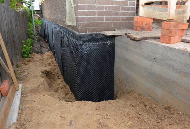 SJ Waterproofing Pros technician performing targeted Vapor Barrier Installation assessment in Vernon, WI